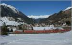 RhB Ge 4/4 III mit einem Albulaschnellzug oberhalb von Berg�n.
16. M�rz 2013